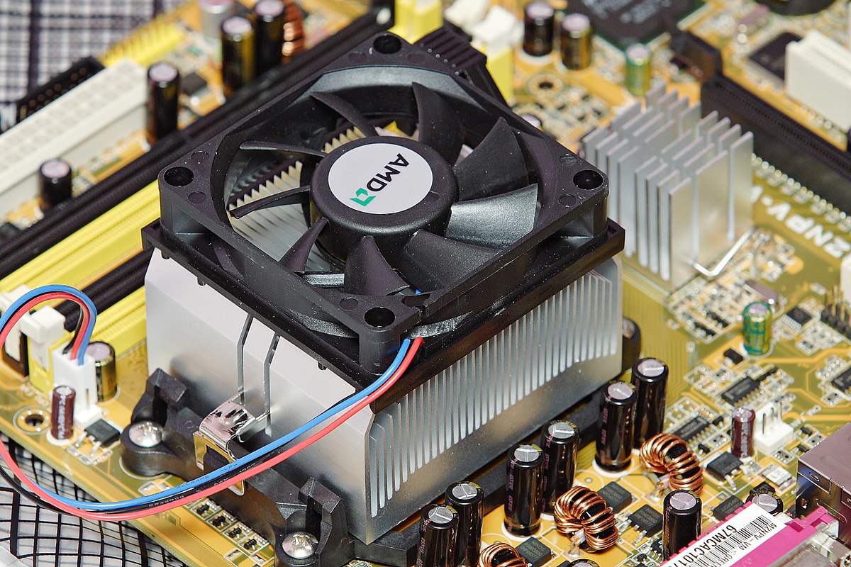 A computer with a fan or thermometer symbolizing overheating issues.