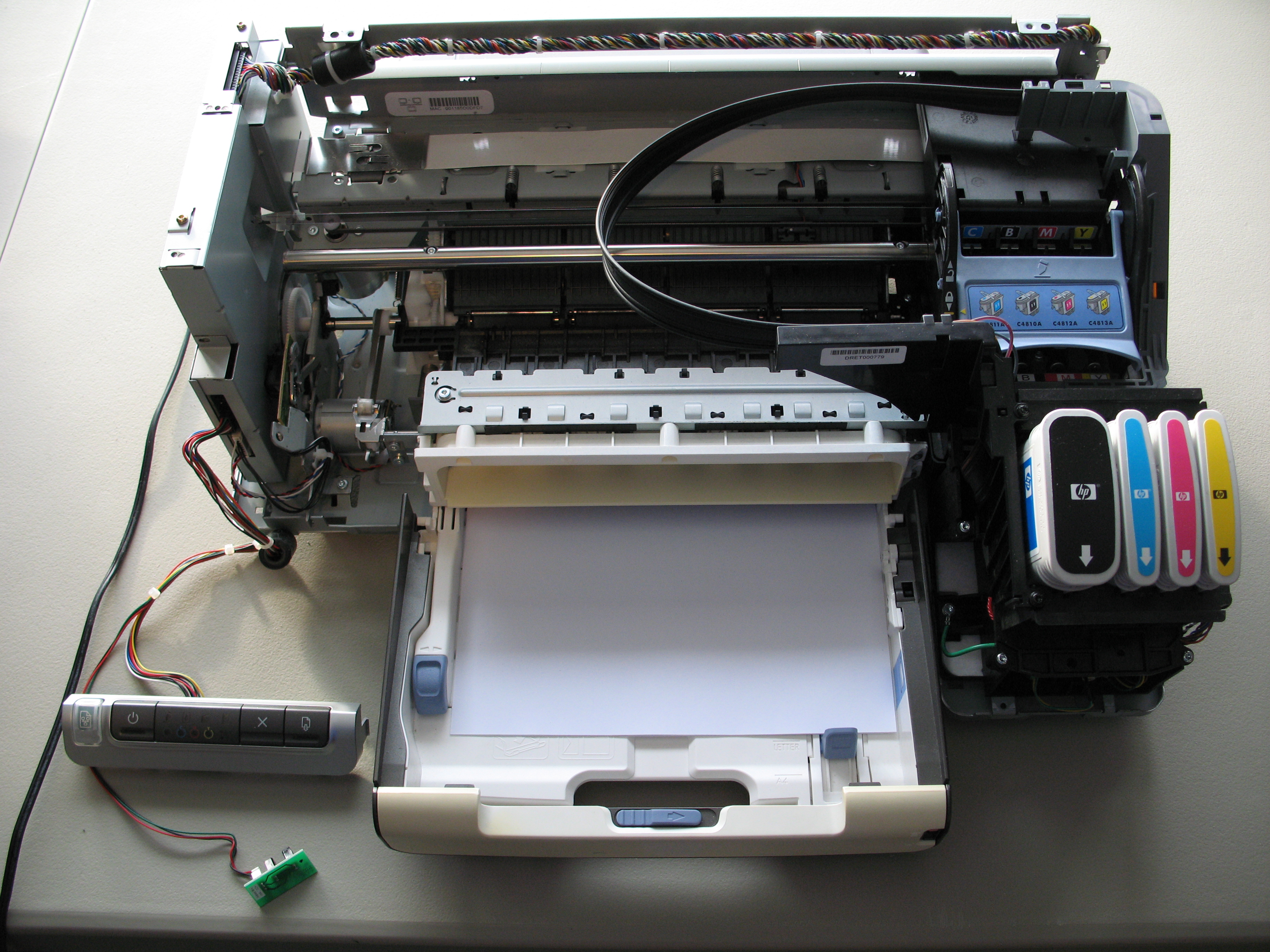 Reinstall the ink cartridges back into the printer.
Close the printer cover.
